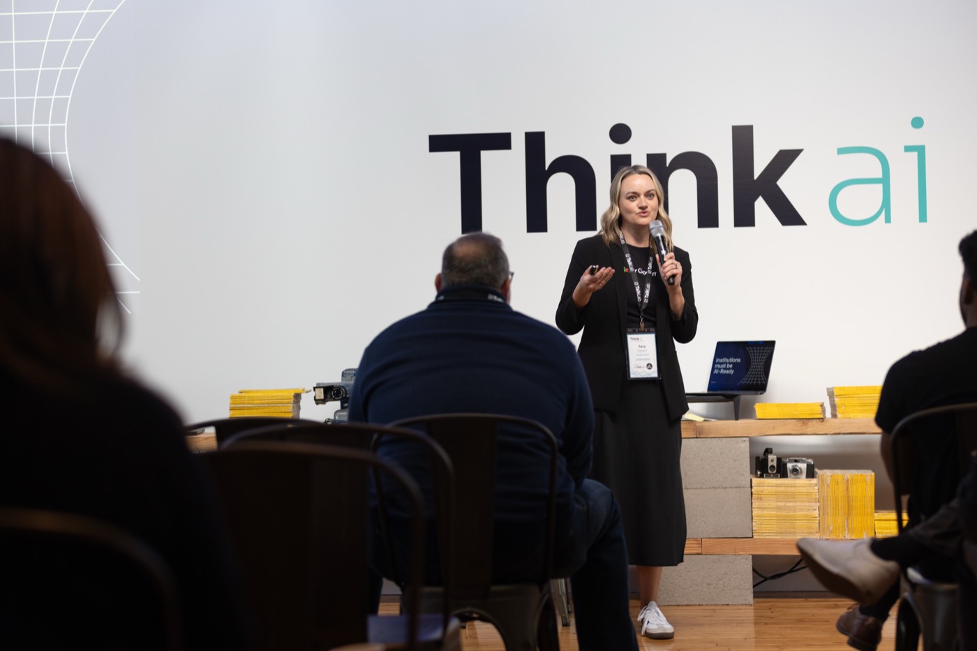 Speaker delivering a keynote at a past AI event