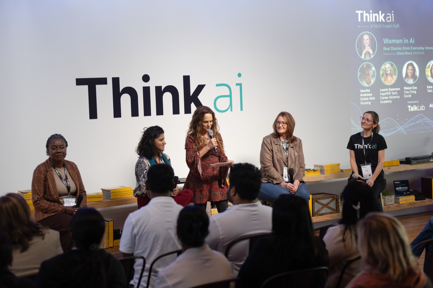 Women in AI panel on stage at a past AI event